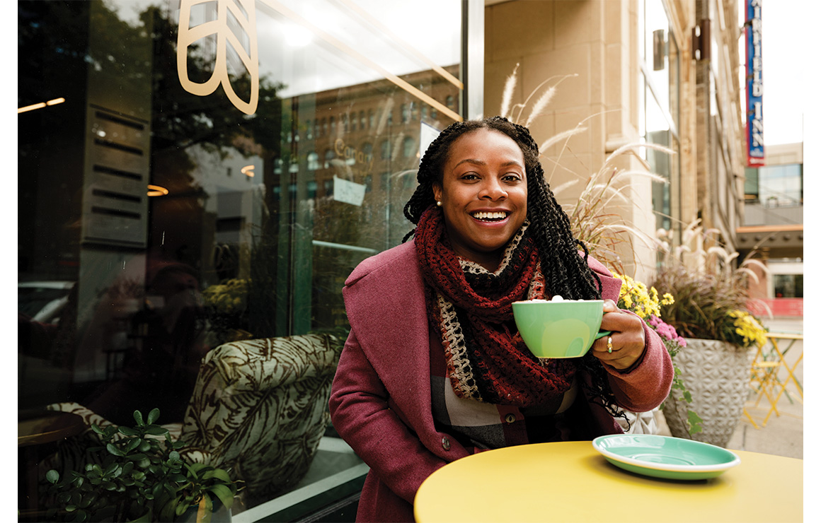 Woman enjoying a coffee outside of Canary Coffee Bar